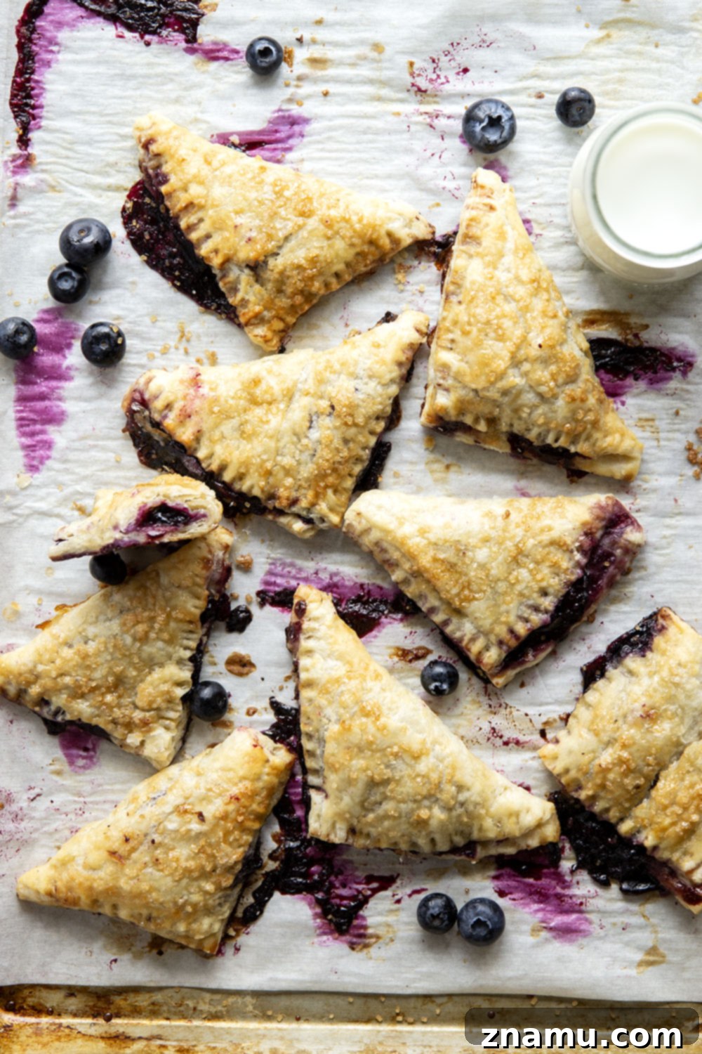 Flaky Blueberry Delights 3 These blueberry turnovers feature a juicy blueberry filling stuffed inside the flakiest homemade pastry dough. The perfect mini-sized pastry!