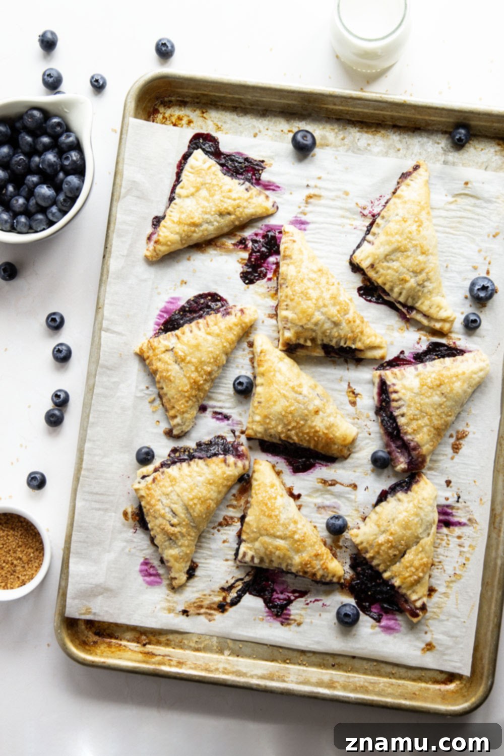 Flaky Blueberry Delights 5 These blueberry turnovers feature a juicy blueberry filling stuffed inside the flakiest homemade pastry dough. The perfect mini-sized pastry!