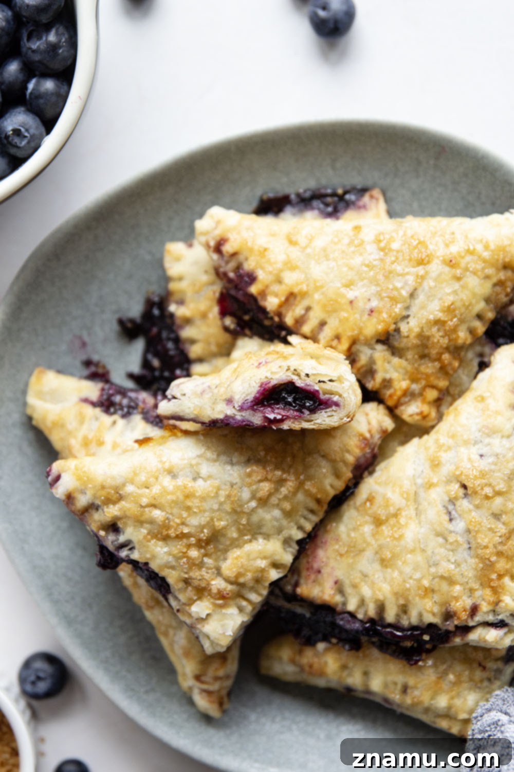 Flaky Blueberry Delights 6 These blueberry turnovers feature a juicy blueberry filling stuffed inside the flakiest homemade pastry dough. The perfect mini-sized pastry!