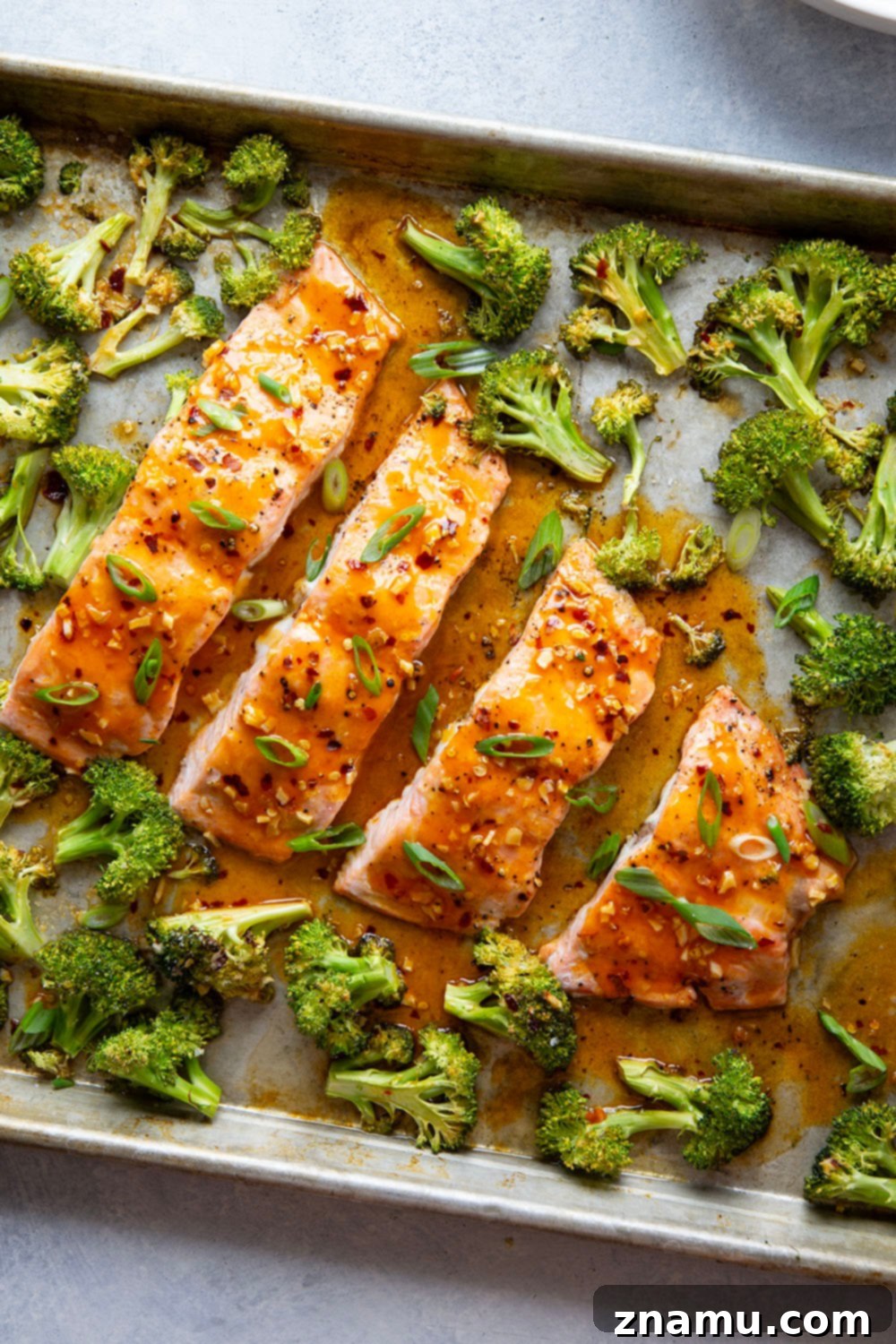 Spicy Honey Glazed Salmon with Roasted Broccoli 4 Ingredients for Hot Honey Glazed Salmon and Broccoli, including fresh salmon, broccoli, honey, hot sauce, butter, and garlic, ready for a quick and easy sheet pan meal.