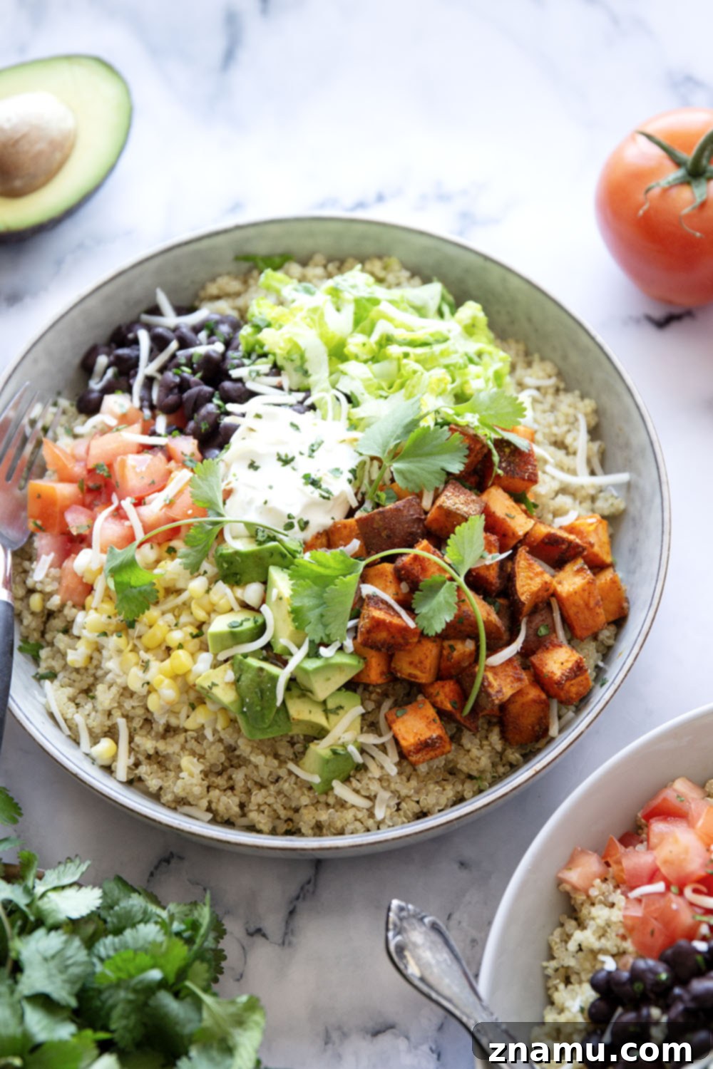Blackened Sweet Potato & Quinoa Power Bowls 6 These quinoa burrito bowls are piled high with flavorful blackened sweet potato cubes and all the burrito bowl fixins' including black beans, corn, avocado, tomato, and lots of cheese.