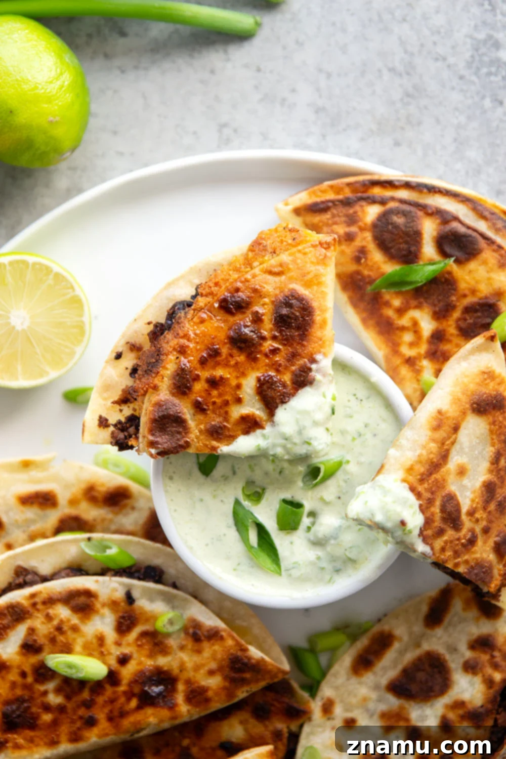 Crispy Black Bean Tacos with Zesty Scallion Lime Sauce 2 Stuffed with a creamy smashed black bean filling and lots of cheese, these crispy black bean tacos are amazing paired with a flavorful scallion lime sauce for dipping.