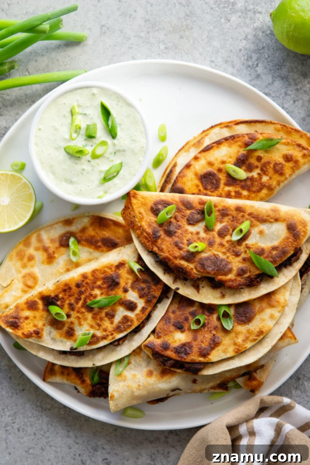 Crispy Black Bean Tacos with Zesty Scallion Lime Sauce 5 Stuffed with a creamy smashed black bean filling and lots of cheese, these crispy black bean tacos are amazing paired with a flavorful scallion lime sauce for dipping.