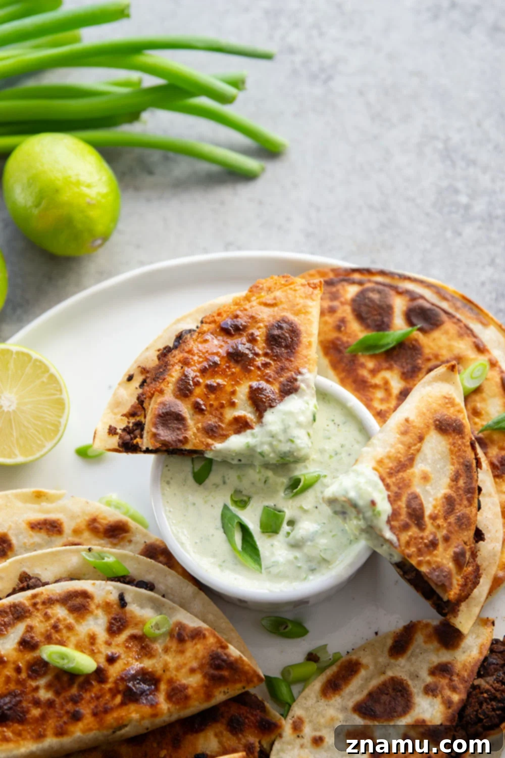 Crispy Black Bean Tacos with Zesty Scallion Lime Sauce 6 Stuffed with a creamy smashed black bean filling and lots of cheese, these crispy black bean tacos are amazing paired with a flavorful scallion lime sauce for dipping.