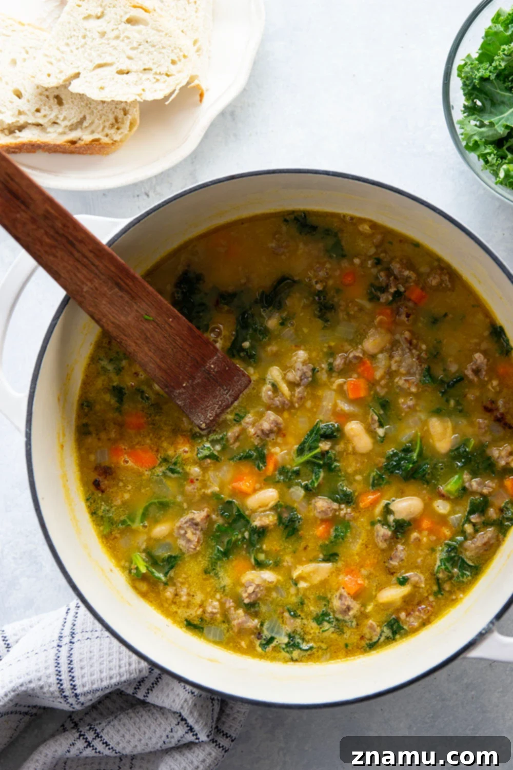 Hearty Miso White Bean And Sausage Kale Soup 3 Savory miso, tender white beans and browned sausage are incredible together in this hearty white bean kale sausage soup! Best paired with a thick wedge of bread for dipping.