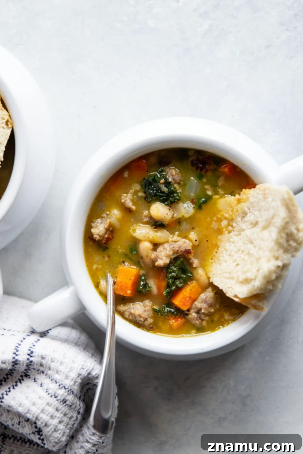 Hearty Miso White Bean And Sausage Kale Soup 4 Savory miso, tender white beans and browned sausage are incredible together in this hearty white bean kale sausage soup! Best paired with a thick wedge of bread for dipping.