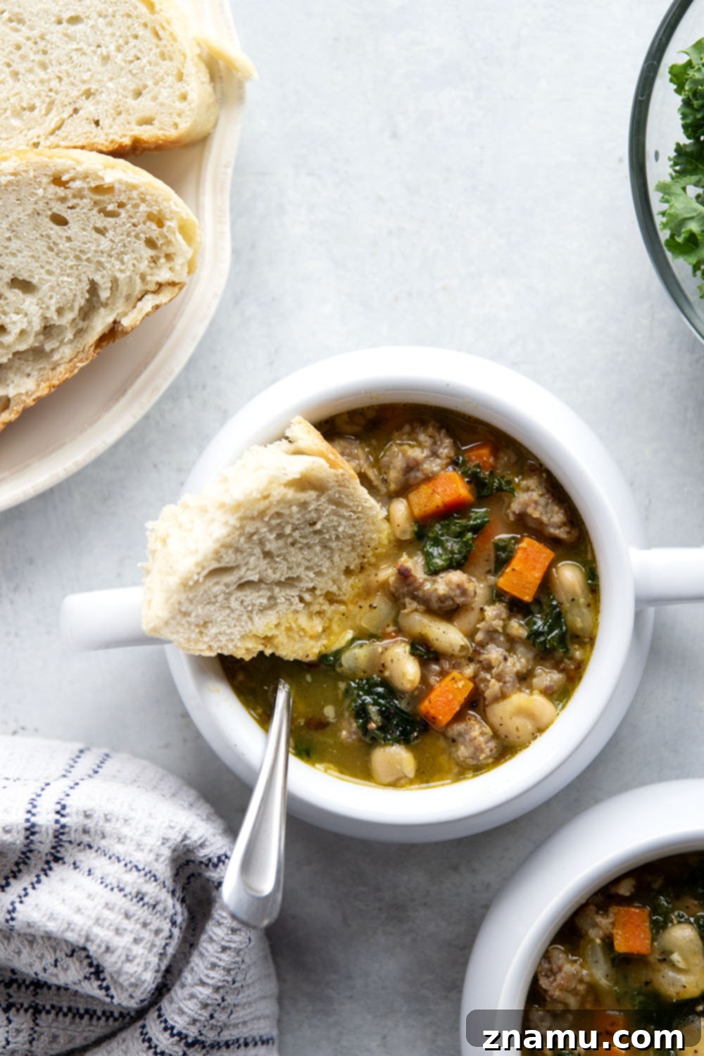 Hearty Miso White Bean And Sausage Kale Soup 5 Savory miso, tender white beans and browned sausage are incredible together in this hearty white bean kale sausage soup! Best paired with a thick wedge of bread for dipping.
