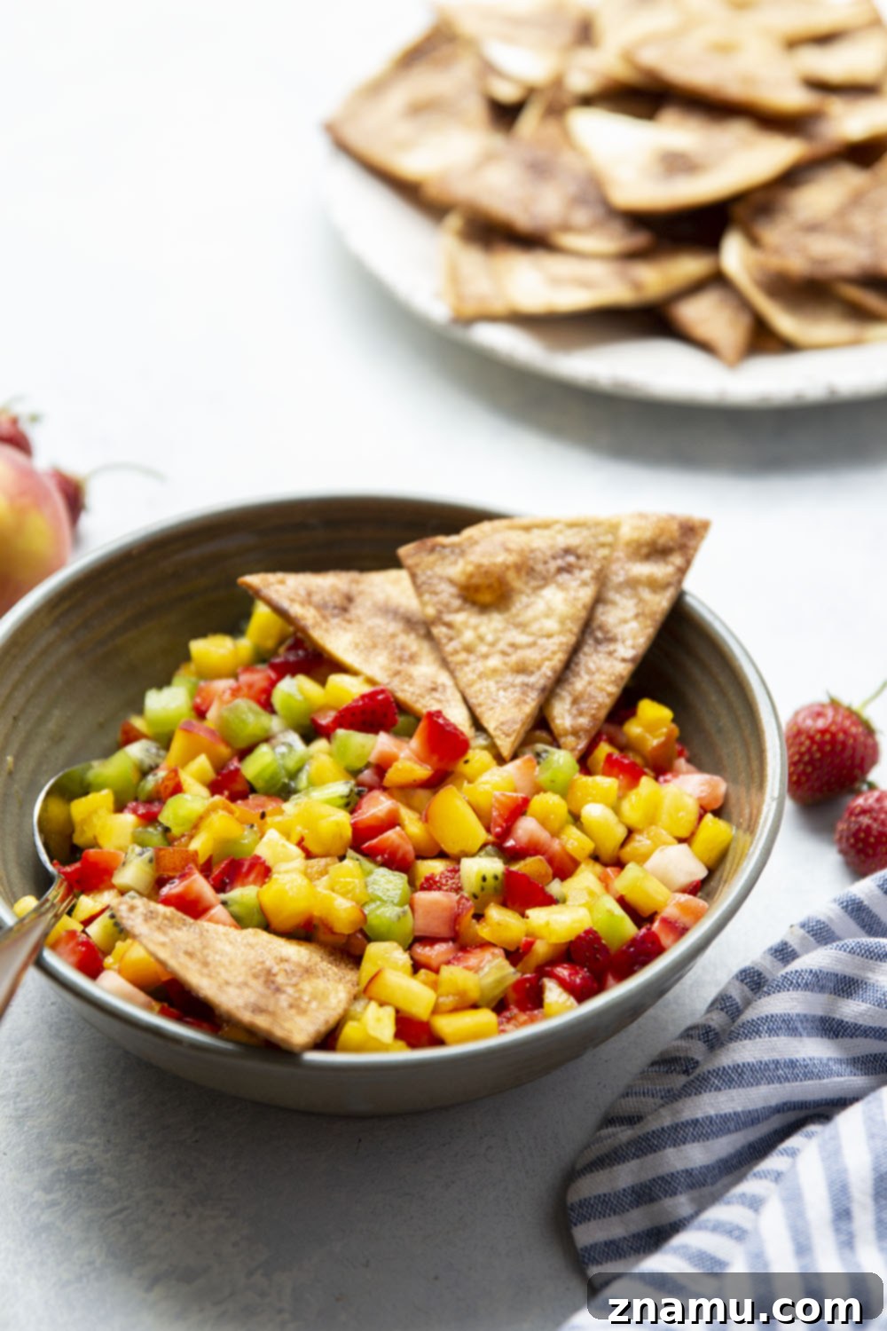 Cinnamon Sugar Crisps with Fresh Fruit Dip 4 Close-up of fresh fruit salsa with finely diced peaches, strawberries, kiwi, and pineapple.