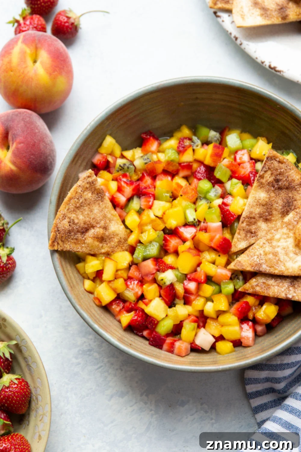 Cinnamon Sugar Crisps with Fresh Fruit Dip 6 Delicious fruit salsa with homemade cinnamon chips ready to be served.