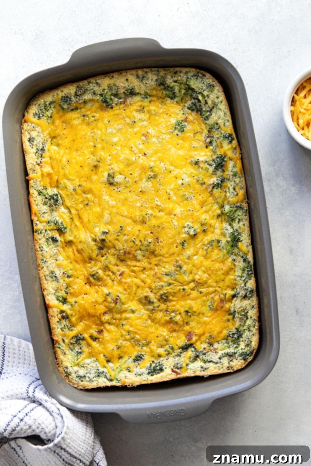 Golden Broccoli Cheddar Egg Bake 3 Tender broccoli and rich cheddar are a dream pairing in this easy cheddar broccoli egg bake that's perfect for serving brunch for a crowd!