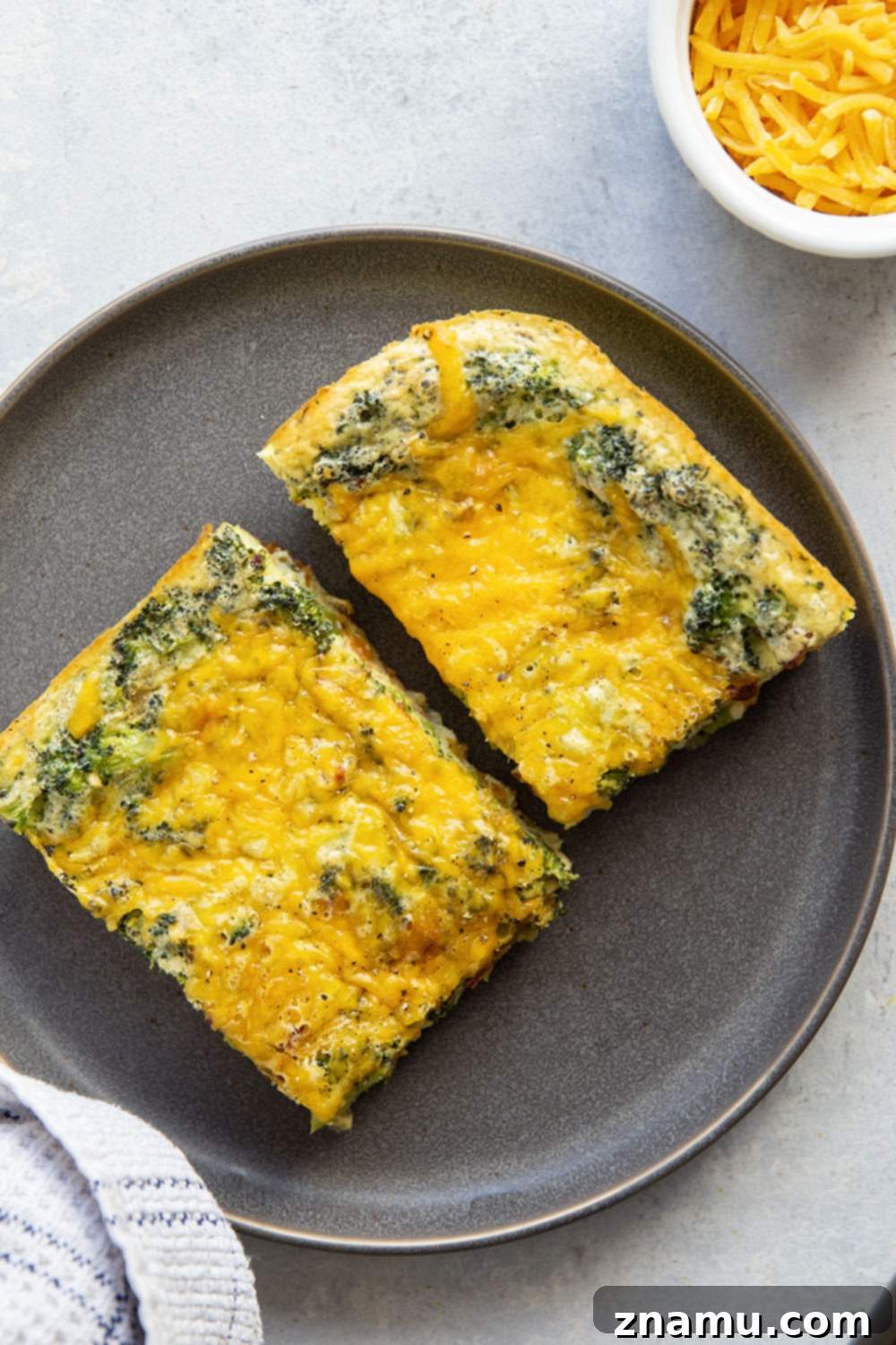 Golden Broccoli Cheddar Egg Bake 4 Tender broccoli and rich cheddar are a dream pairing in this easy cheddar broccoli egg bake that's perfect for serving brunch for a crowd!