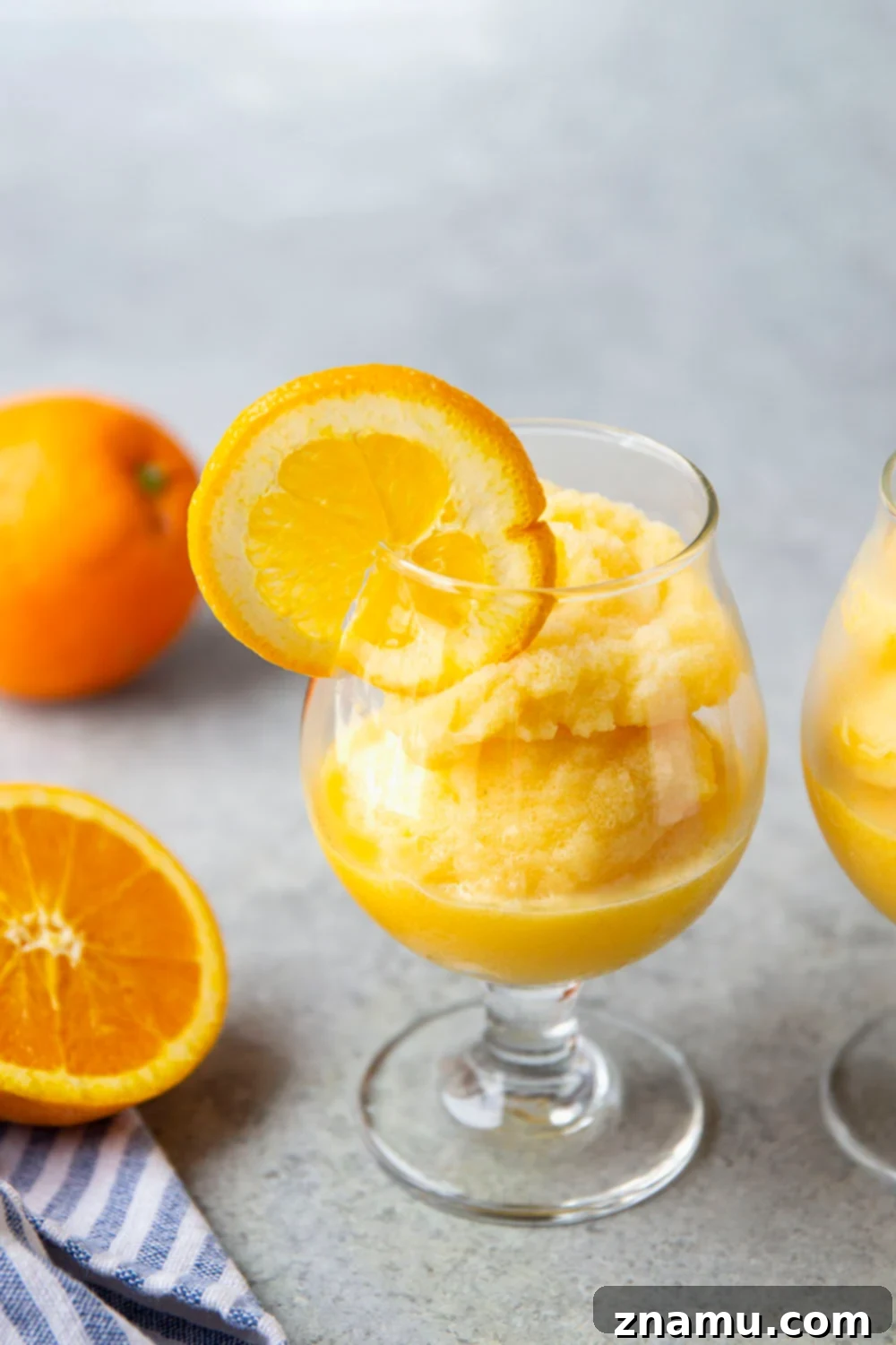 Orange Julius Frosted Delights 4 Orange Julius Slushies with orange slices, quick and easy recipe for a refreshing drink.