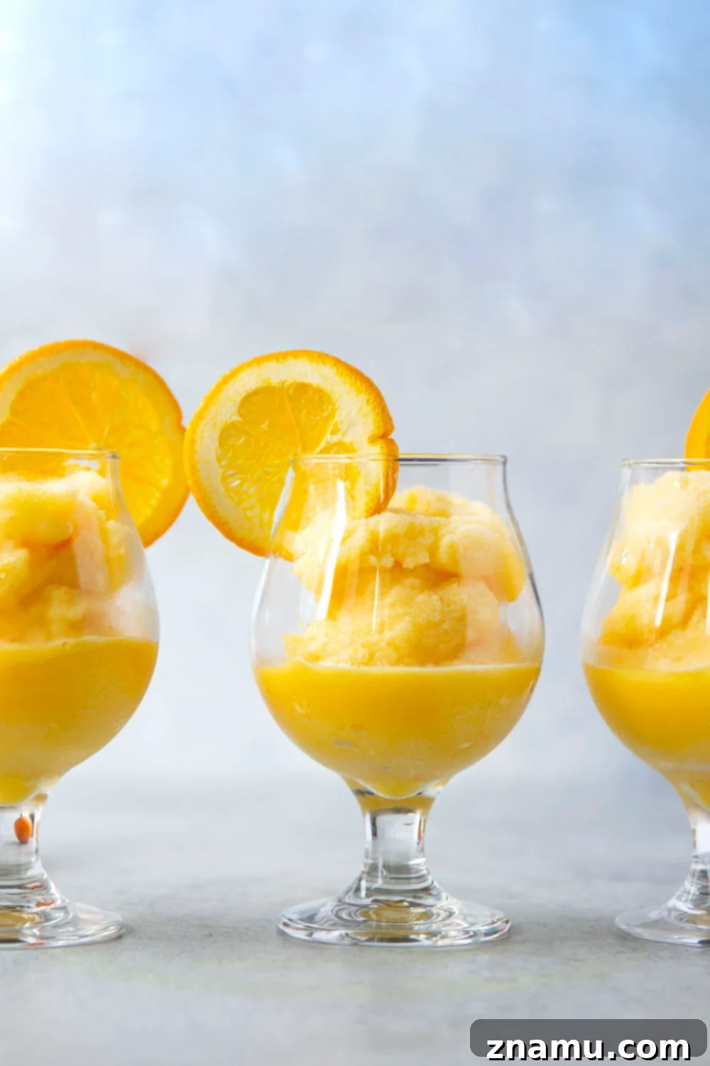 Orange Julius Frosted Delights 5 Close-up of Orange Julius Slushie in a glass, ready to be enjoyed.