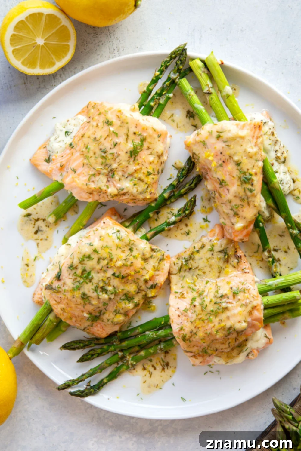 Lemon Dill Salmon with Asparagus Stuffing 2 This asparagus stuffed salmon features tender salmon fillets stuffed with a mixture of herbed cream cheese and tender asparagus and then drizzled in a buttery lemon dill sauce.