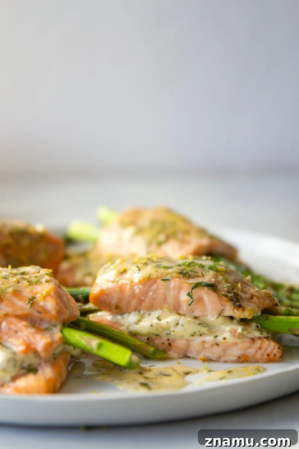 Lemon Dill Salmon with Asparagus Stuffing 4 This asparagus stuffed salmon features tender salmon fillets stuffed with a mixture of herbed cream cheese and tender asparagus and then drizzled in a buttery lemon dill sauce.