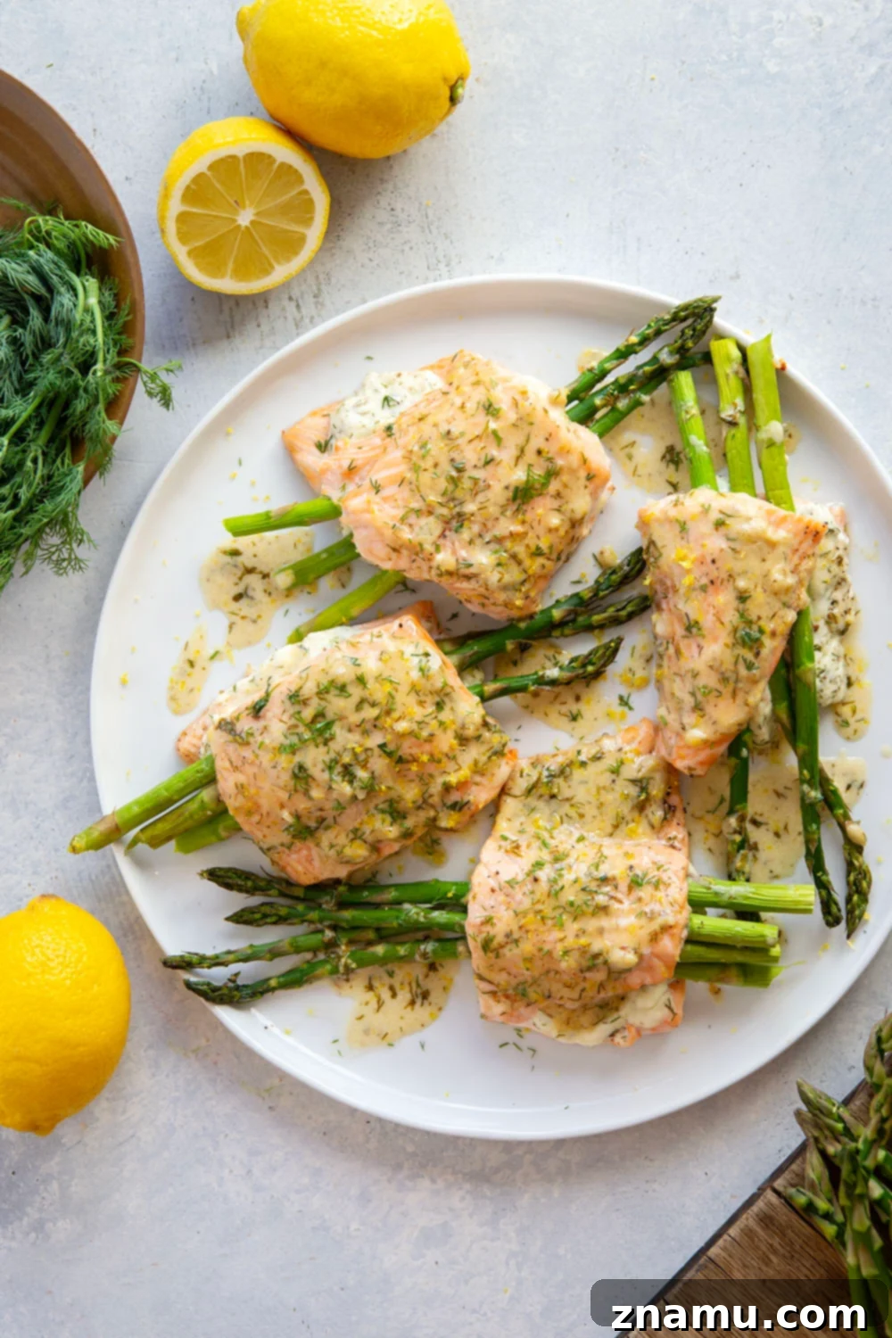 Lemon Dill Salmon with Asparagus Stuffing 5 This asparagus stuffed salmon features tender salmon fillets stuffed with a mixture of herbed cream cheese and tender asparagus and then drizzled in a buttery lemon dill sauce.