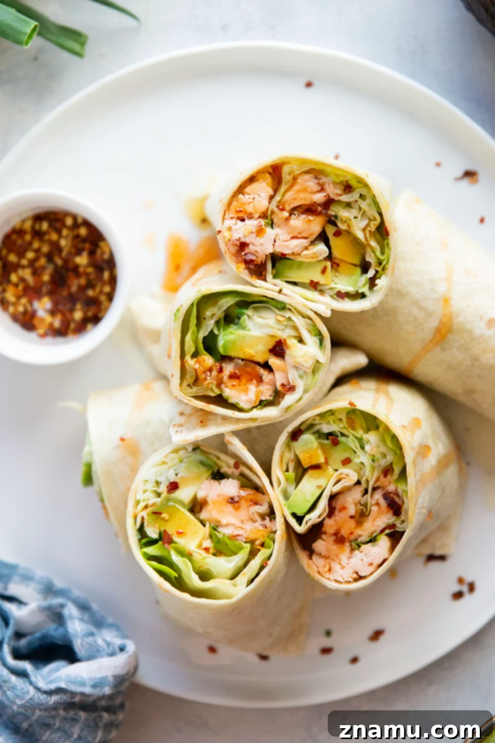 Sweet Heat Salmon Wrap 4 Assembling a Hot Honey Salmon Wrap with all the delicious components laid out.