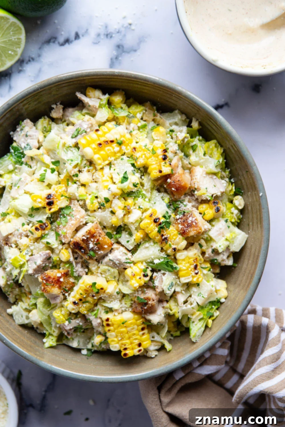 Zesty Elote Chopped Salad 6 A vibrant bowl of Mexican Street Corn Chopped Salad, perfectly dressed and ready to serve.