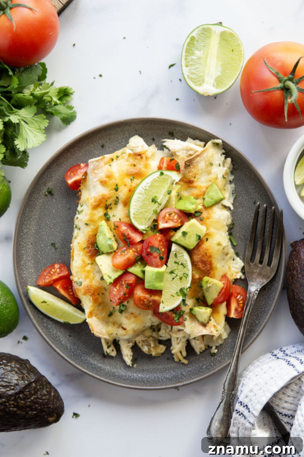 One-Skillet Green Chile Chicken Enchiladas 4 Baked in a creamy salsa verde sauce and stuffed with tender green chile chicken, these skillet green chile chicken enchiladas are piled high with the works!