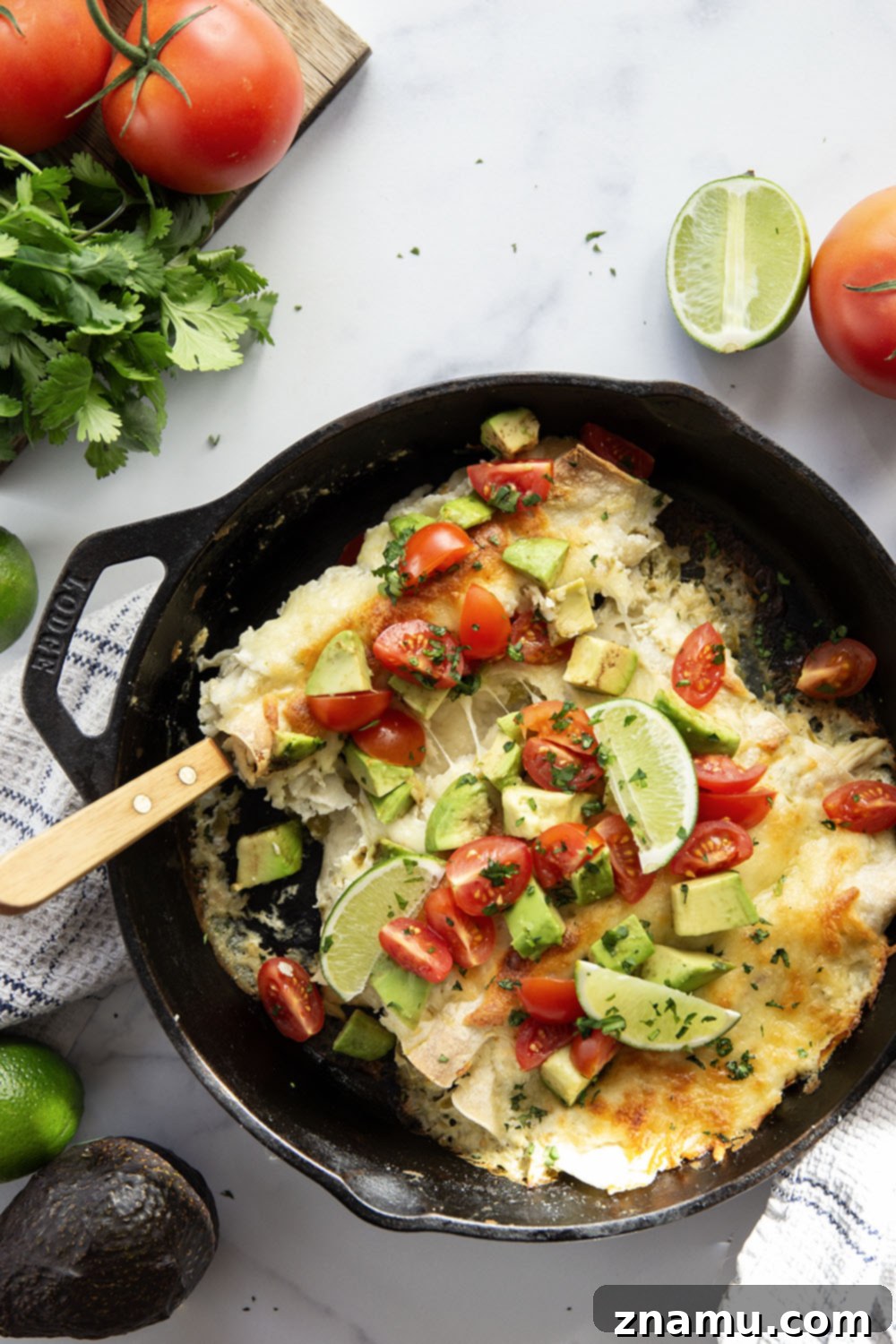 One-Skillet Green Chile Chicken Enchiladas 6 Baked in a creamy salsa verde sauce and stuffed with tender green chile chicken, these skillet green chile chicken enchiladas are piled high with the works!