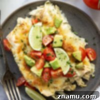 Baked in a creamy salsa verde sauce and stuffed with tender green chile chicken, these skillet green chile chicken enchiladas are piled high with the works!