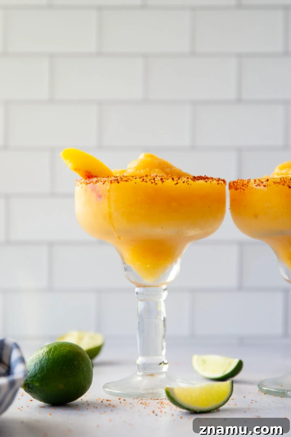 Frozen Peach Margarita 2 Blend up this frozen peach margarita in minutes with only a handful of ingredients! Serve them ice cold with a spicy tajin or salty rim.