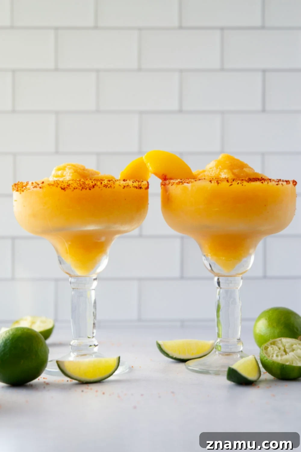 Frozen Peach Margarita 4 Blend up this frozen peach margarita in minutes with only a handful of ingredients! Serve them ice cold with a spicy tajin or salty rim.