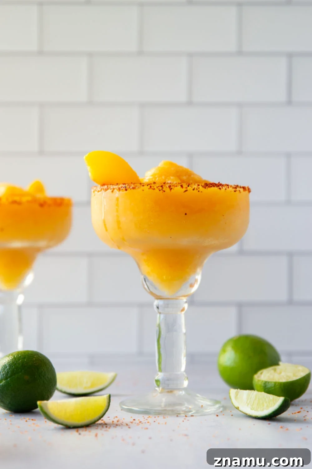 Frozen Peach Margarita 5 Blend up this frozen peach margarita in minutes with only a handful of ingredients! Serve them ice cold with a spicy tajin or salty rim.