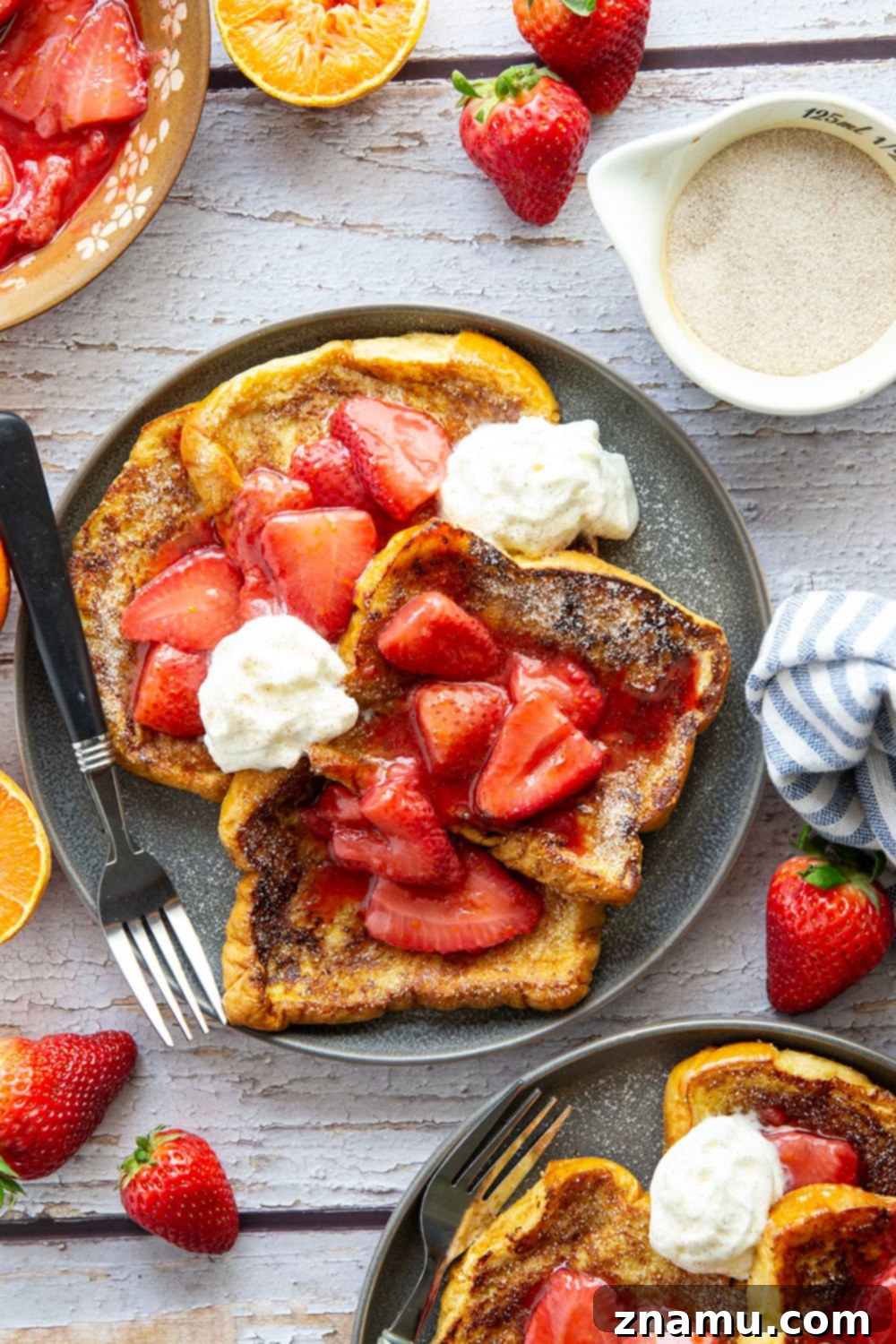 Golden Cinnamon Sugar French Toast with Zesty Strawberry Orange Sauce 2 Delight in Cinnamon Sugar French Toast topped with a fresh strawberry orange sauce for an unforgettable breakfast.