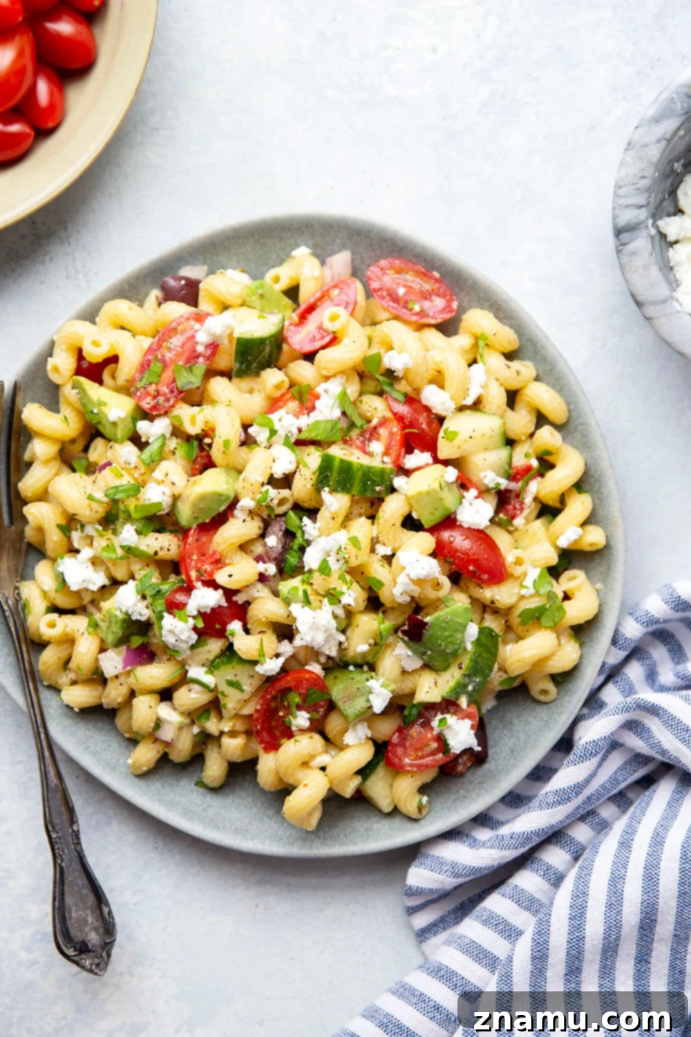 Mediterranean Sunshine Pasta 6 A large serving bowl filled with Greek pasta salad, ready to be served.