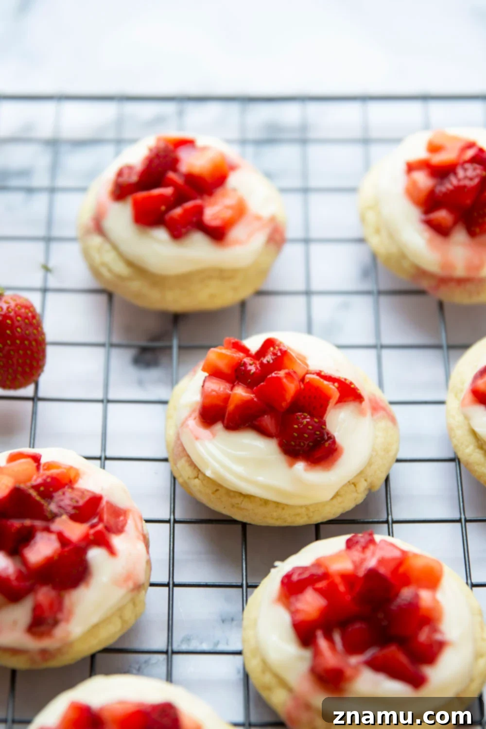 Ultimate Strawberry Shortcake Cookies 2 Strawberry Shortcake Cookies with a soft vanilla base, rich cream cheese frosting, and fresh strawberries, perfect for summer.