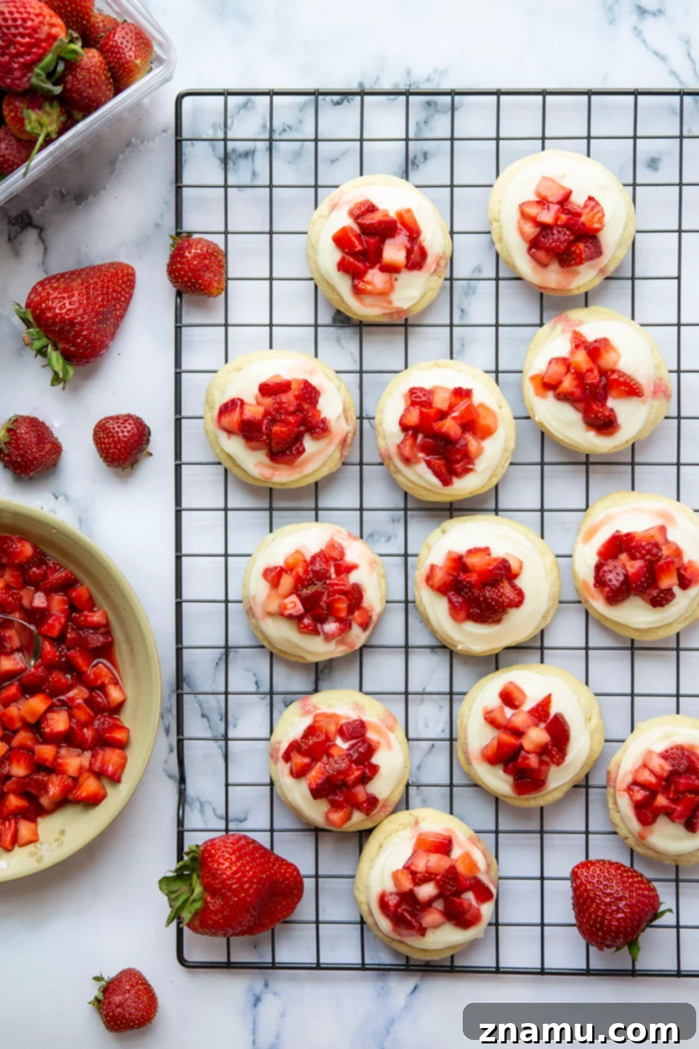 Ultimate Strawberry Shortcake Cookies 3 Close-up of Strawberry Shortcake Cookies, highlighting the creamy frosting and vibrant strawberries.