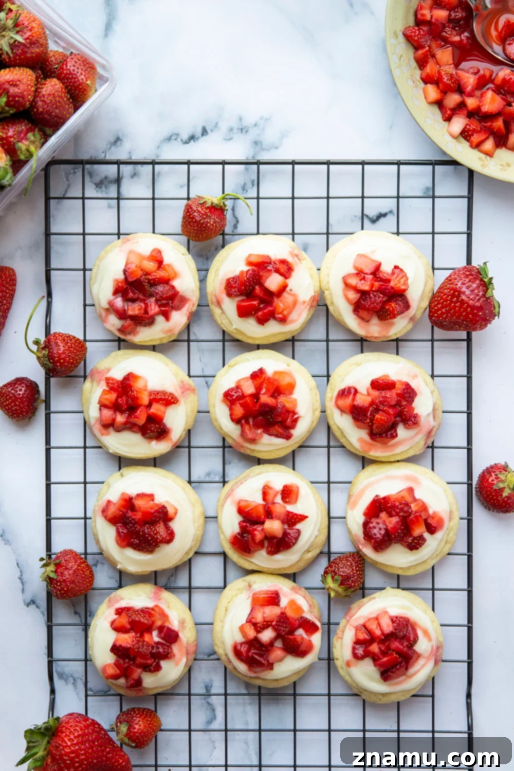 Ultimate Strawberry Shortcake Cookies 5 Strawberry Shortcake Cookies cooling on a wire rack, ready for frosting and fresh strawberries.