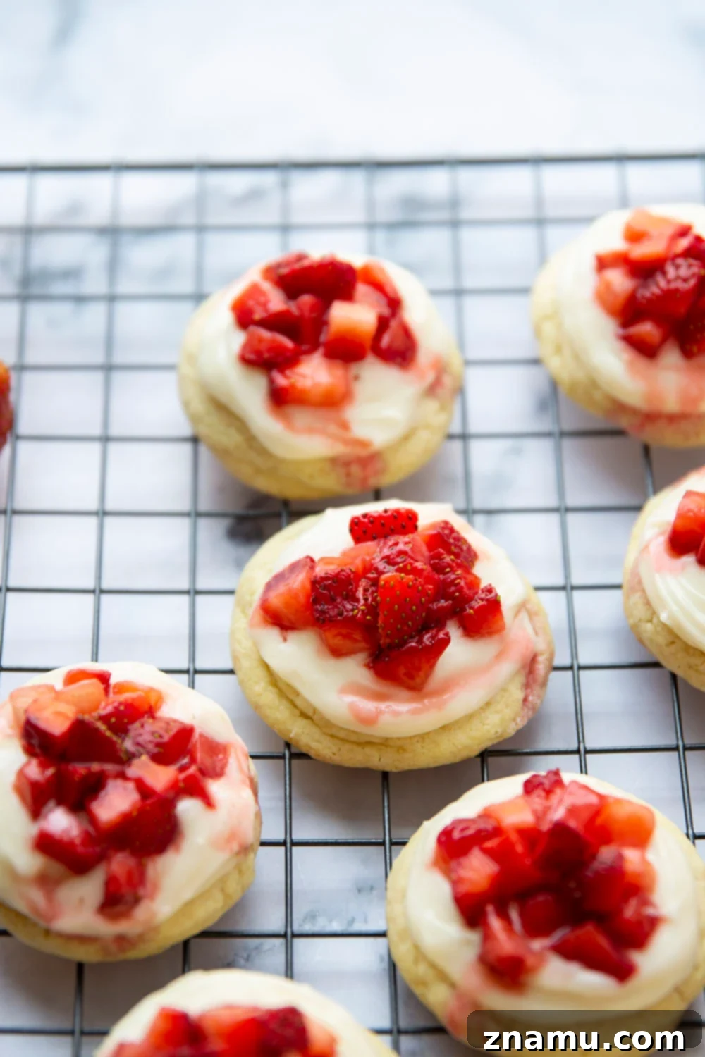 Ultimate Strawberry Shortcake Cookies 6 A plate of freshly baked Strawberry Shortcake Cookies, ready to be enjoyed as a perfect summer dessert.