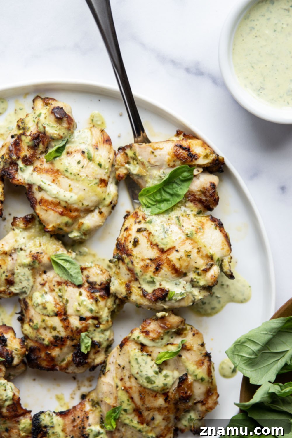 Green Goddess Fire-Kissed Chicken 4 This green goddess grilled chicken features juicy chicken thighs marinated in an herby homemade green goddess dressing and grilled until perfectly smoky and tender.