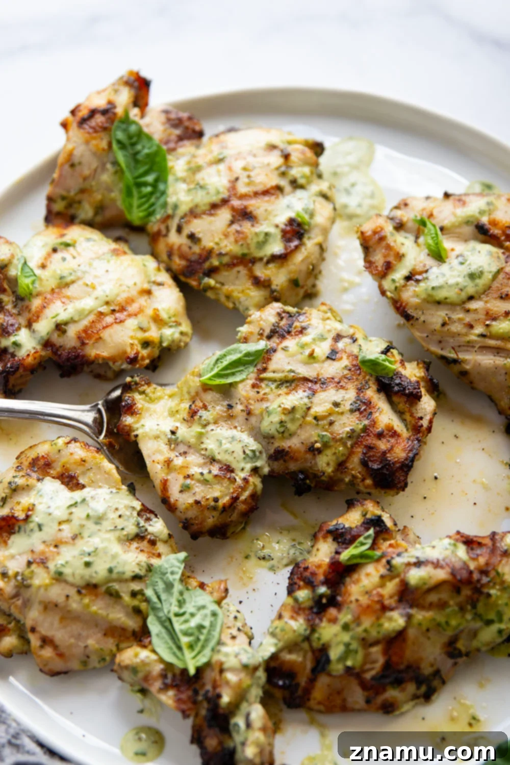 Green Goddess Fire-Kissed Chicken 6 This green goddess grilled chicken features juicy chicken thighs marinated in an herby homemade green goddess dressing and grilled until perfectly smoky and tender.