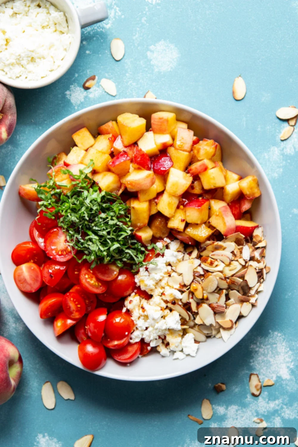 Peach Feta Heatwave Salad 2 This peach feta salad features juicy peaches, tangy feta, and an incredible sweet and spicy hot honey sauce coating every bite!