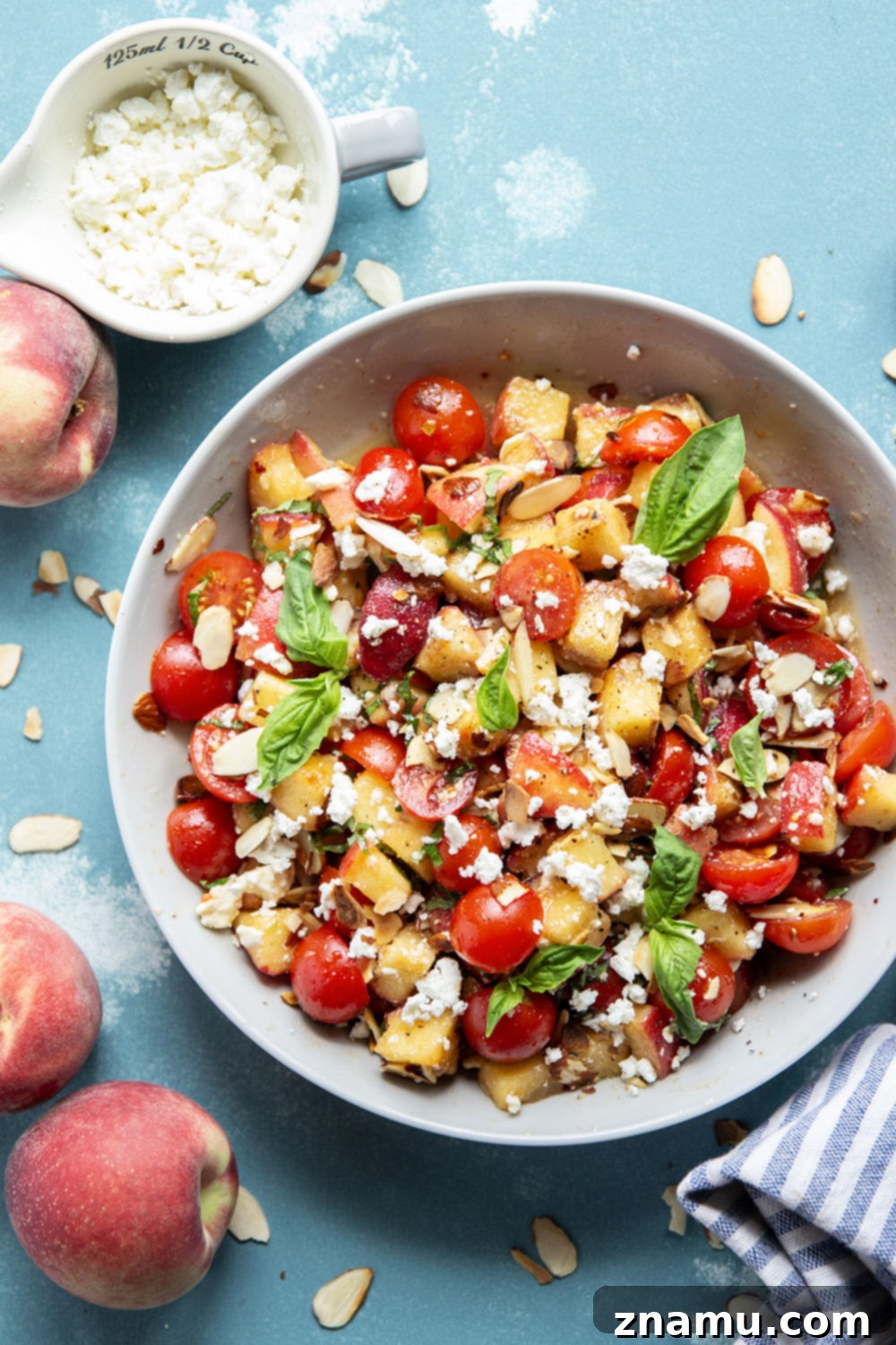 Peach Feta Heatwave Salad 3 This peach feta salad features juicy peaches, tangy feta, and an incredible sweet and spicy hot honey sauce coating every bite!