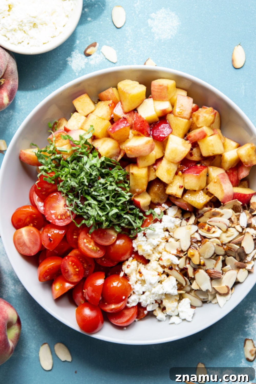 Peach Feta Heatwave Salad 4 This peach feta salad features juicy peaches, tangy feta, and an incredible sweet and spicy hot honey sauce coating every bite!