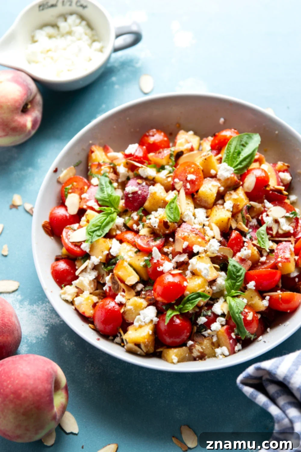 Peach Feta Heatwave Salad 6 This peach feta salad features juicy peaches, tangy feta, and an incredible sweet and spicy hot honey sauce coating every bite!