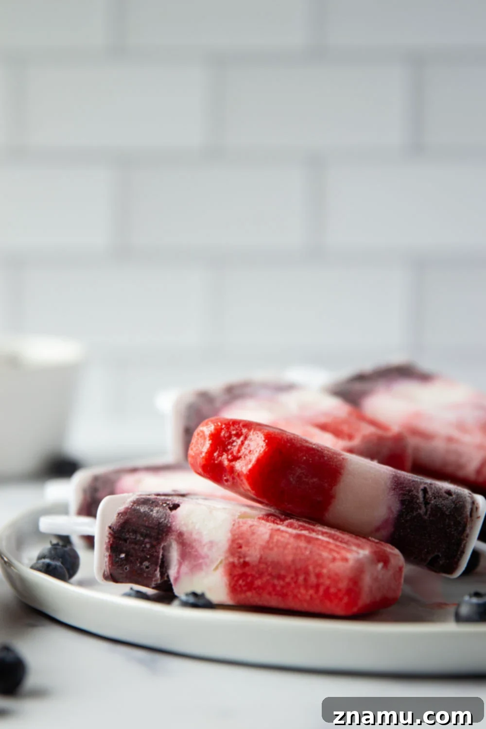 Stars and Stripes Pops 4 Homemade red, white, and blue popsicles with fresh fruit
