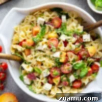 Golden Peach Caprese Pasta 8 Sweet peaches pair perfectly with herby basil, soft mozzarella, juicy cherry tomatoes, and a tangy balsamic dressing in this peach caprese pasta salad.