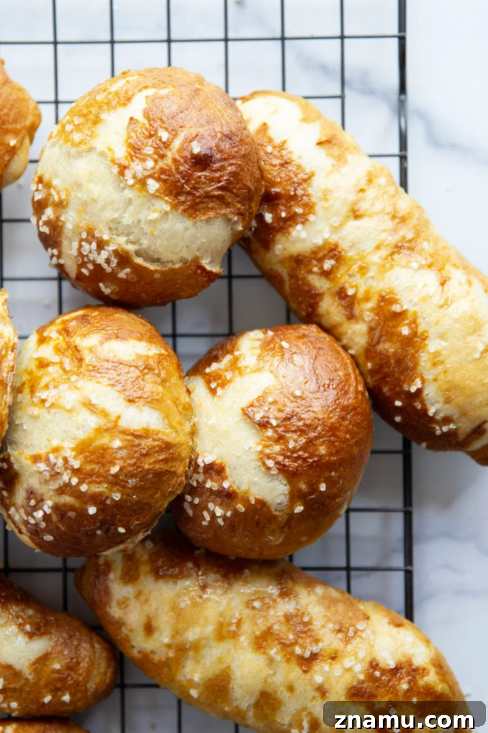 Effortless No-Knead Pretzel Buns 2 These no-knead pretzel buns are perfectly soft and sturdy inside with a golden, crispy exterior. Use them as a base for hamburgers, hot dogs, brats, and pretty much any sandwich you can think of!