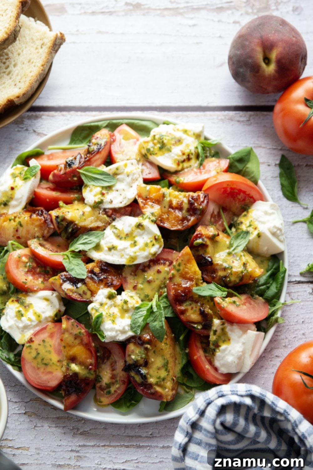 Sweet Ember Burrata with Zesty Basil Spark 4 Ingredients for grilled peach burrata salad laid out, including fresh basil, ripe peaches, and burrata.