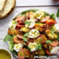 Smoky grilled peaches and creamy burrata cheese are a dream pairing in this grilled peach burrata salad that's drizzled with a spicy fresh basil vinaigrette.