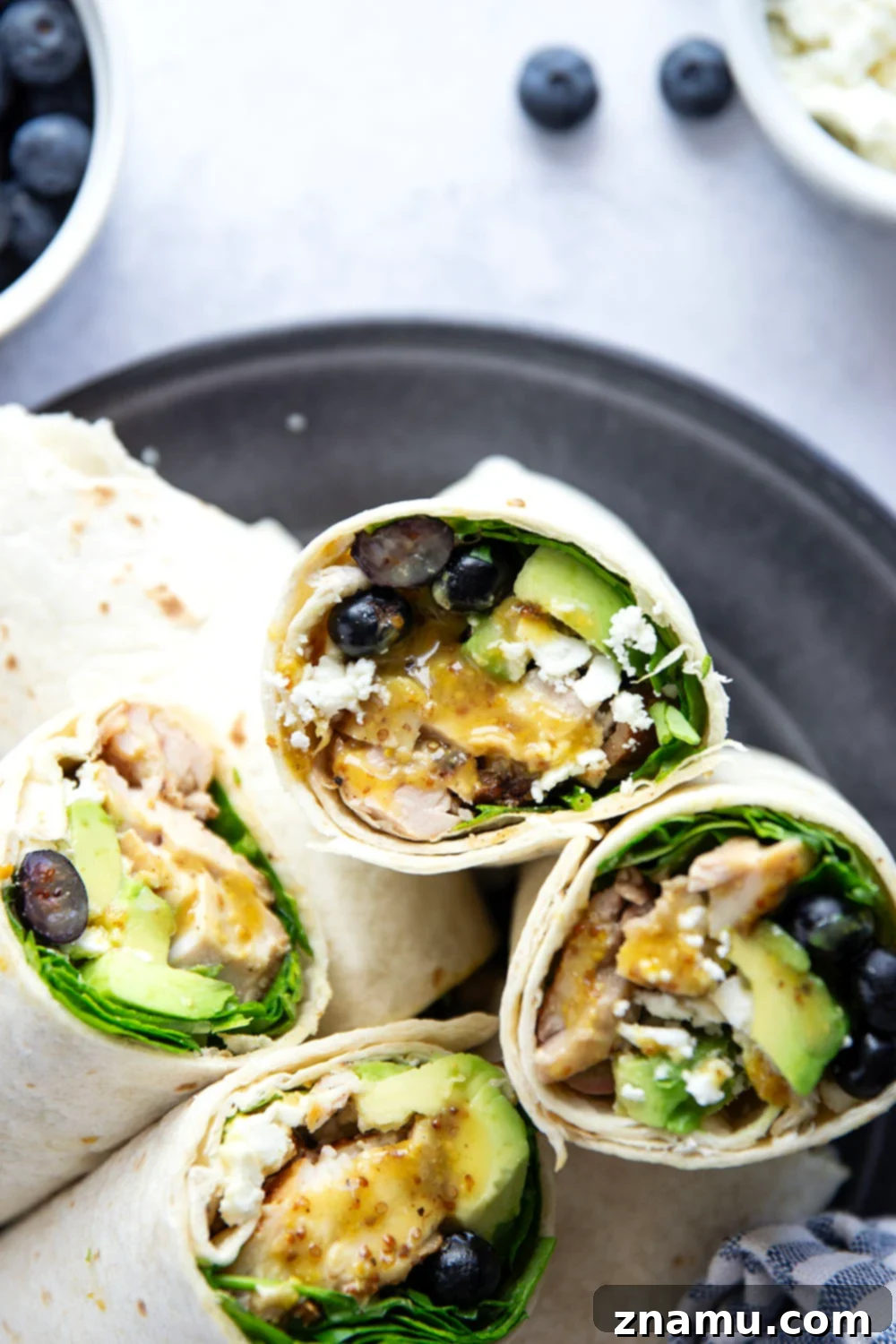 Stuffed with juicy honey mustard grilled chicken, sweet blueberries, silky avocado, and lots of greens, this honey mustard chicken wrap is easy to prep ahead of time for a stellar lunch!