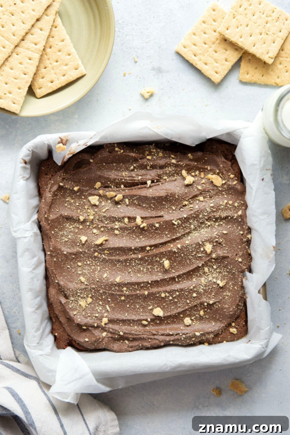 Golden Graham Brownies, Crowned with Whipped Chocolate Ganache 3 These graham cracker brownies feature a fudgy brownie layer baked on top of a buttery graham cracker crust base and topped with fluffy whipped chocolate ganache.