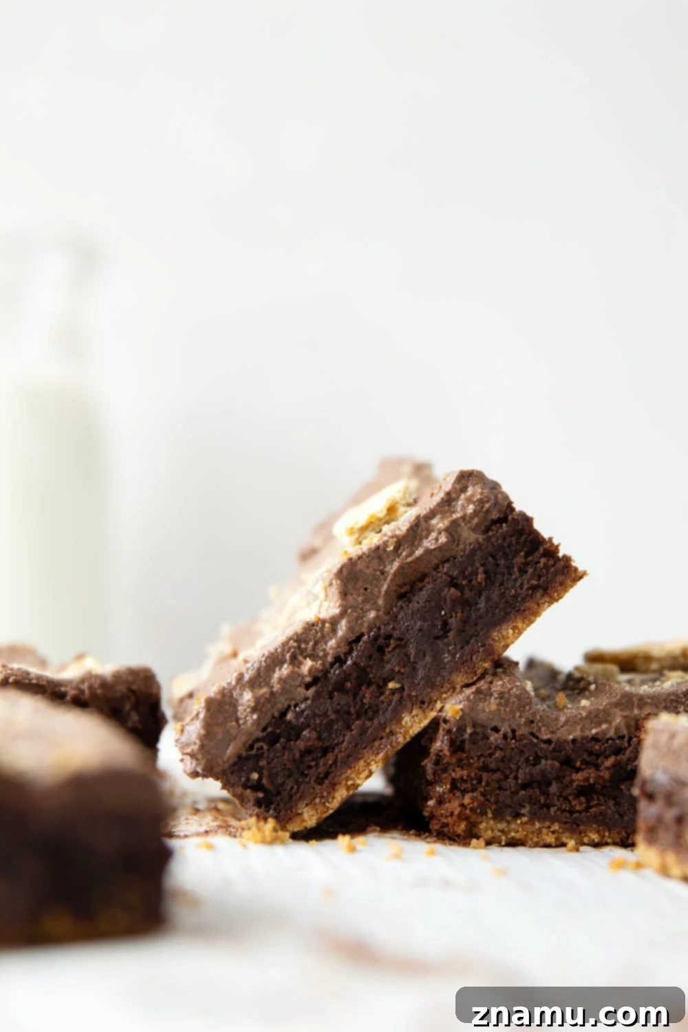 Golden Graham Brownies, Crowned with Whipped Chocolate Ganache 5 These graham cracker brownies feature a fudgy brownie layer baked on top of a buttery graham cracker crust base and topped with fluffy whipped chocolate ganache.