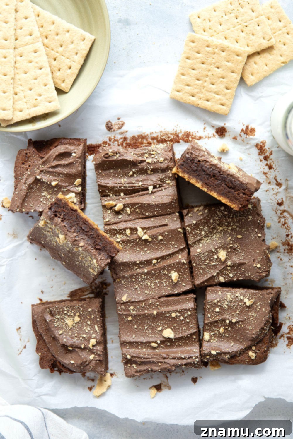 Golden Graham Brownies, Crowned with Whipped Chocolate Ganache 6 These graham cracker brownies feature a fudgy brownie layer baked on top of a buttery graham cracker crust base and topped with fluffy whipped chocolate ganache.