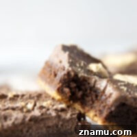 Golden Graham Brownies, Crowned with Whipped Chocolate Ganache 8 These graham cracker brownies feature a fudgy brownie layer baked on top of a buttery graham cracker crust base and topped with fluffy whipped chocolate ganache.